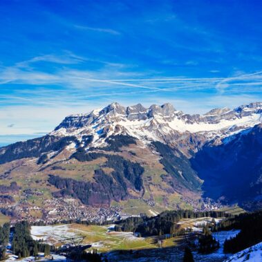 Historic Bellinzona Castle perched on a hilltop, surrounded by lush green landscape