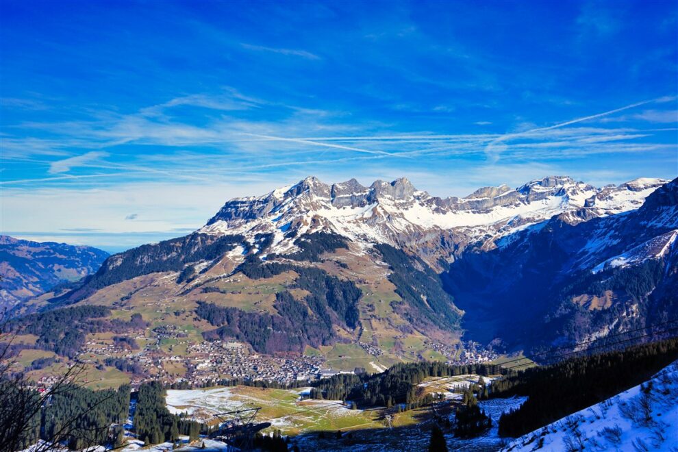 Historic Bellinzona Castle perched on a hilltop, surrounded by lush green landscape