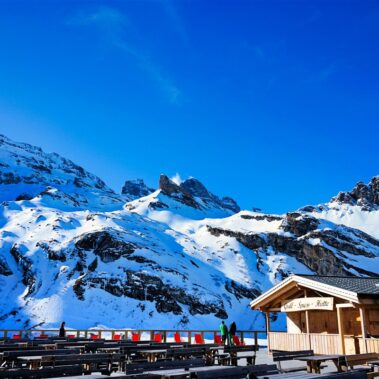 Historic Bellinzona Castle perched on a hilltop, surrounded by lush green landscape