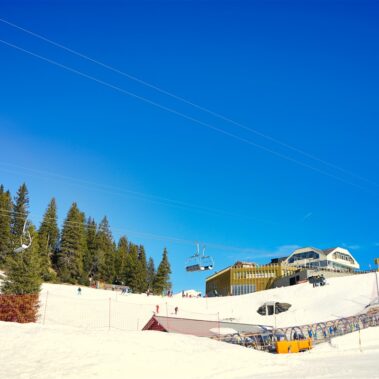 Historic Bellinzona Castle perched on a hilltop, surrounded by lush green landscape