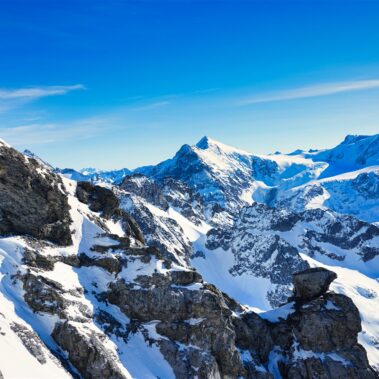 Rolling hills of Mendrisio dotted with traditional Swiss farmhouses and grazing sheep