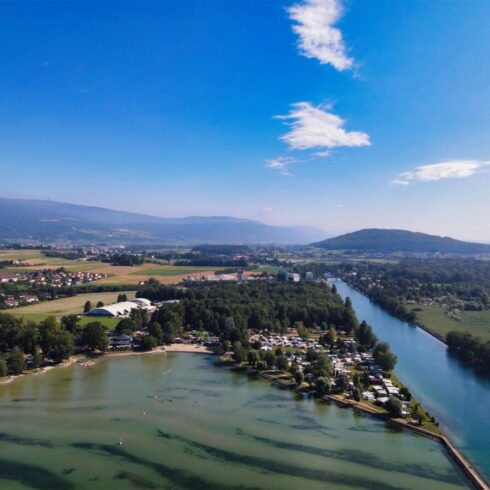 Sunrise casting warm golden light over the towering peaks of the Swiss Alps
