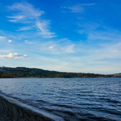 Aerial view of Lugano with its sparkling lake and the surrounding lush mountains