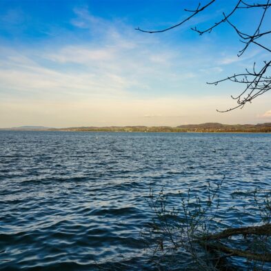 Aerial view of Lugano with its sparkling lake and the surrounding lush mountains