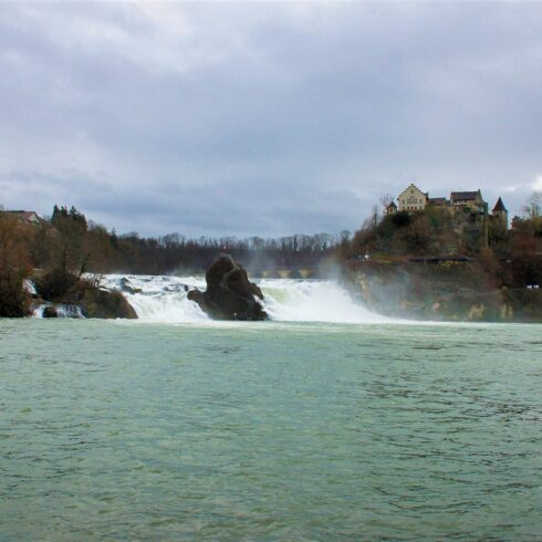 Sweeping panoramic view of the Swiss Alps with expansive valleys and rocky peaks