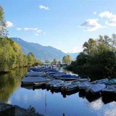 Aerial view of Lugano with its sparkling lake and the surrounding lush mountains
