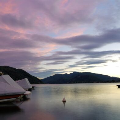 Aerial view of Lugano with its sparkling lake and the surrounding lush mountains