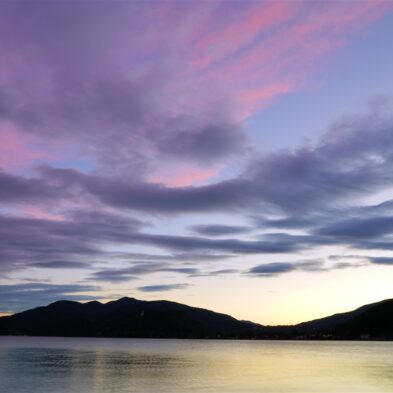 Aerial view of Lugano with its sparkling lake and the surrounding lush mountains