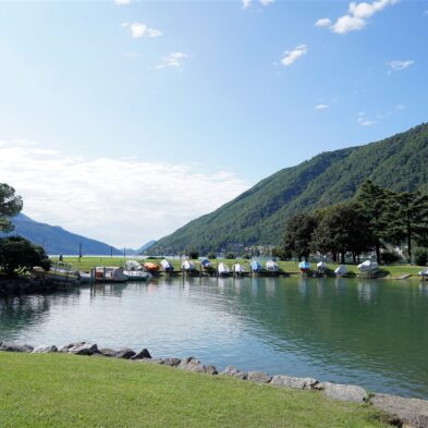 Aerial view of Lugano with its sparkling lake and the surrounding lush mountains