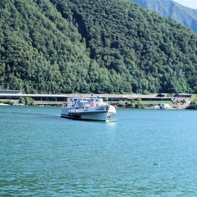 Aerial view of Lugano with its sparkling lake and the surrounding lush mountains