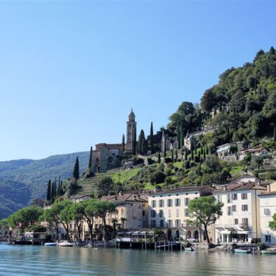 Aerial view of Lugano with its sparkling lake and the surrounding lush mountains