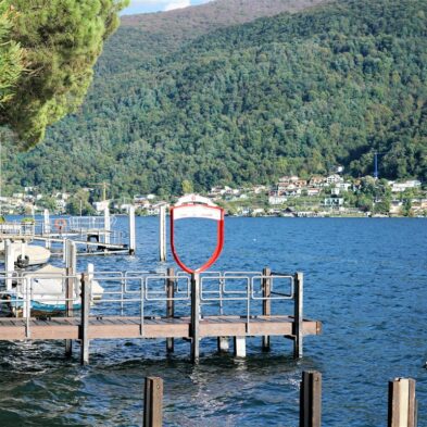Aerial view of Lugano with its sparkling lake and the surrounding lush mountains