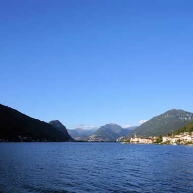 Aerial view of Lugano with its sparkling lake and the surrounding lush mountains