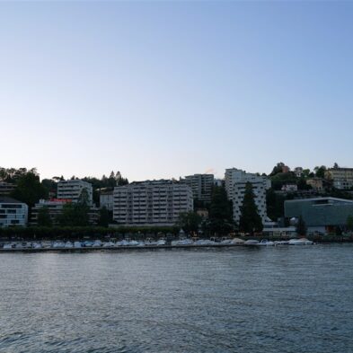 Aerial view of Lugano with its sparkling lake and the surrounding lush mountains