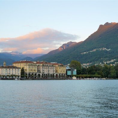 Aerial view of Lugano with its sparkling lake and the surrounding lush mountains