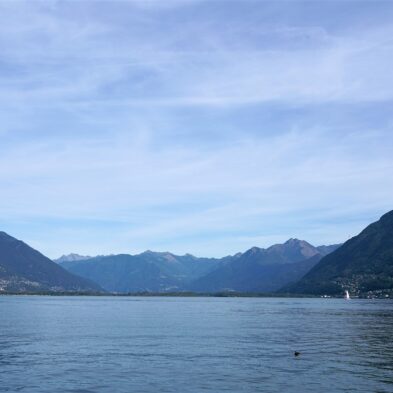 Aerial view of Lugano with its sparkling lake and the surrounding lush mountains