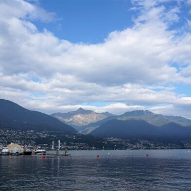 Aerial view of Lugano with its sparkling lake and the surrounding lush mountains