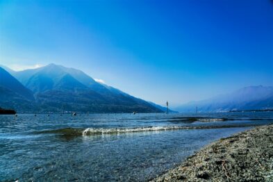 Alpine meadows dotted with wildflowers, nestled between rugged mountain peaks near Furka